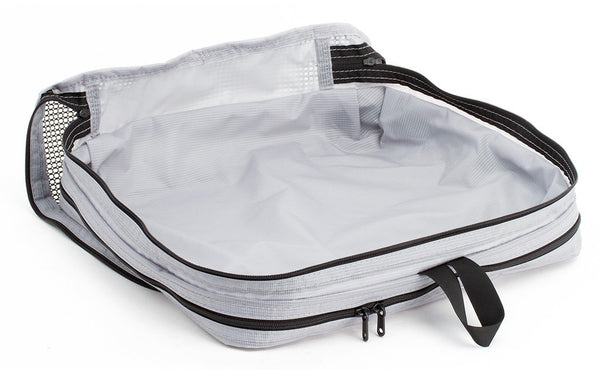 An empty and open Northwest Sky (light grey) Aether Large Aeronaut 30 Packing Cube mesh side up.